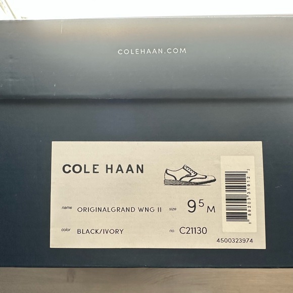 Cole Haan Black and Tan Wingtip Oxfords with Brogue Detailing